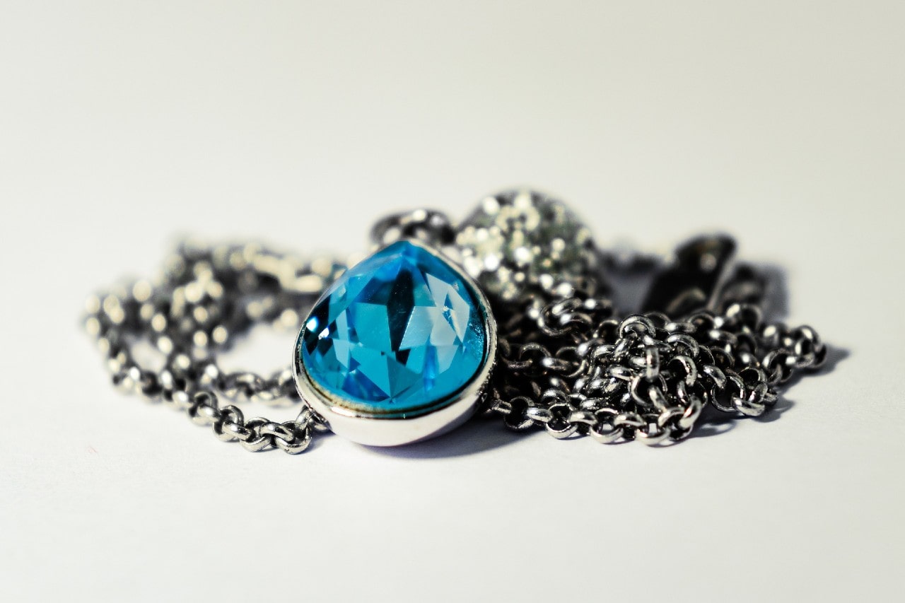Necklace with blue topaz pendant in a pear shape