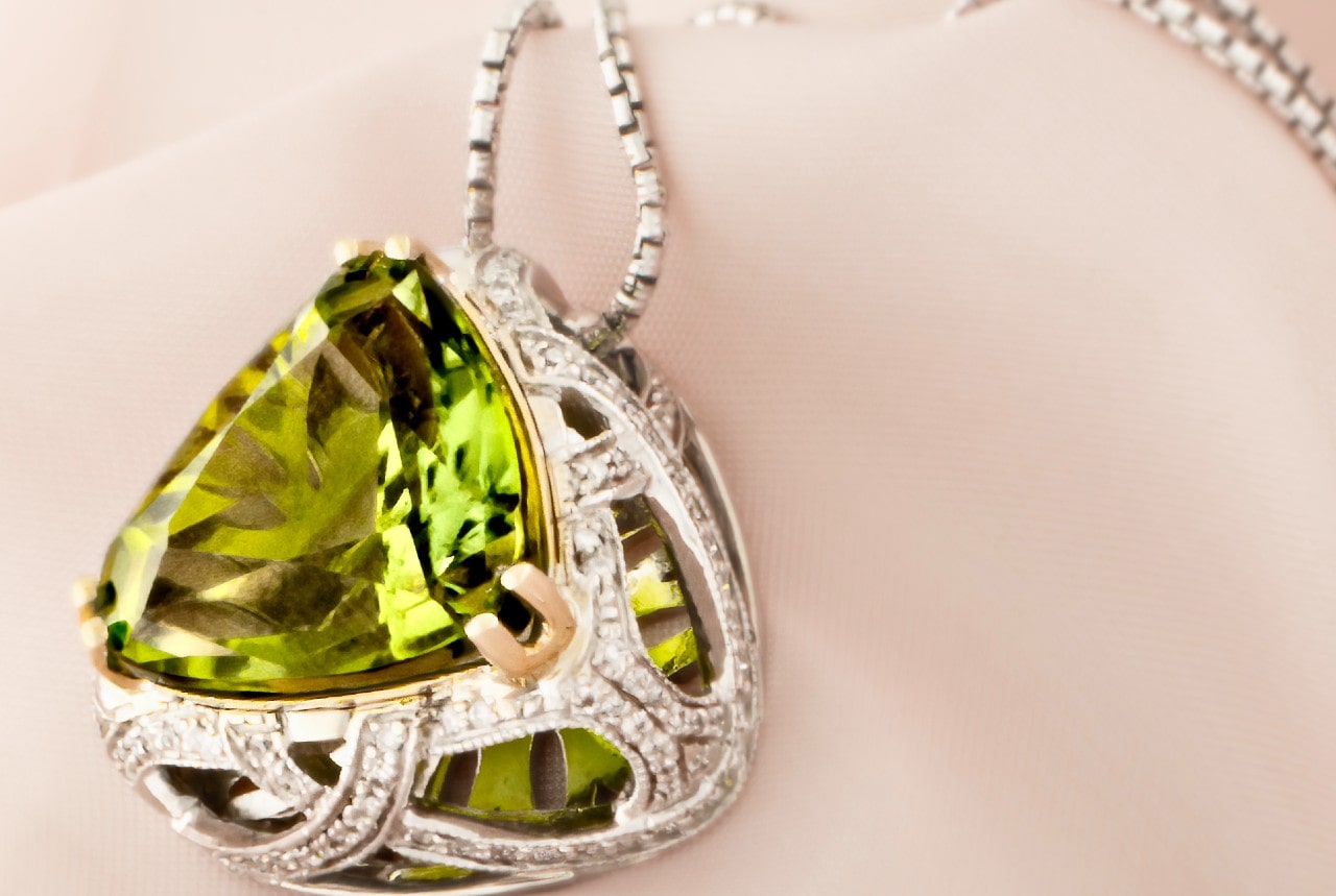 Peridot pendant with stunning ornate metalwork