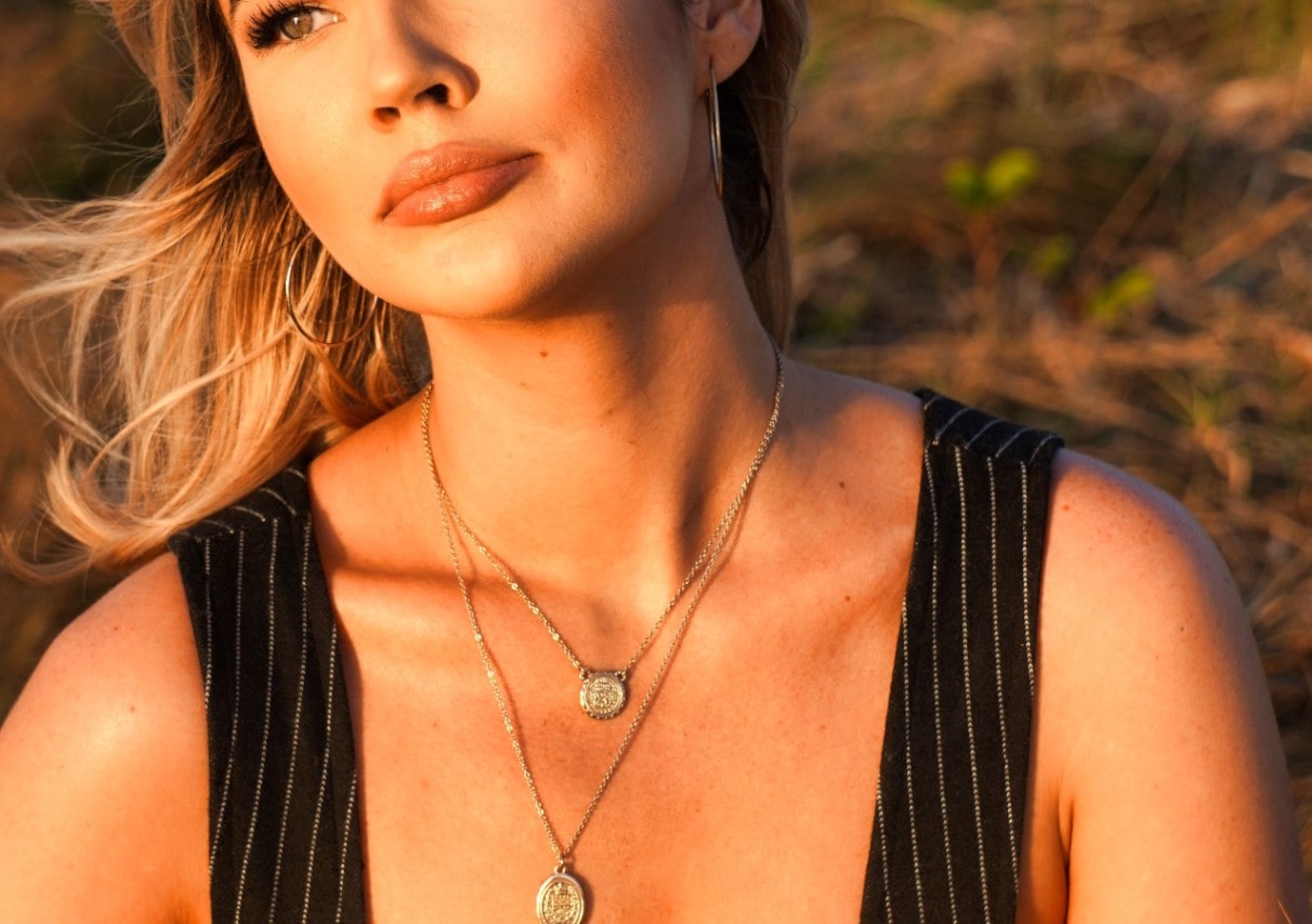 Fashionable lady wearing two necklaces
