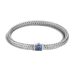 Sterling silver weaved bracelet with sapphire details on the clasp