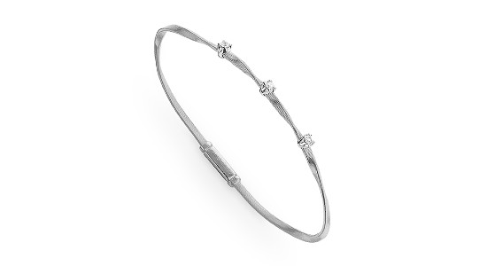 Silver twisted bangle imbued with three small diamonds