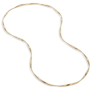 A chain necklace from Marrakech features twisted gold strands