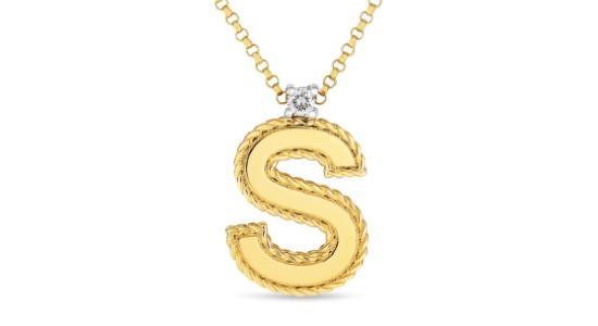A yellow gold initial pendant necklace with a letter “S” from Roberto Coin, available at Weston Jewelers.