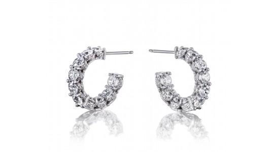 A white gold pair of TACORI diamond huggie earrings, available at Weston Jewelers.