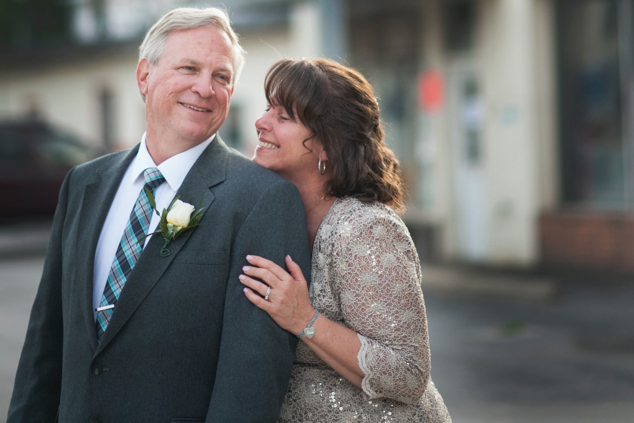 married couple smiling and dressed up after an outing