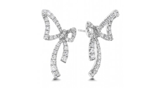 a pair of diamond stud earrings shaped into bows