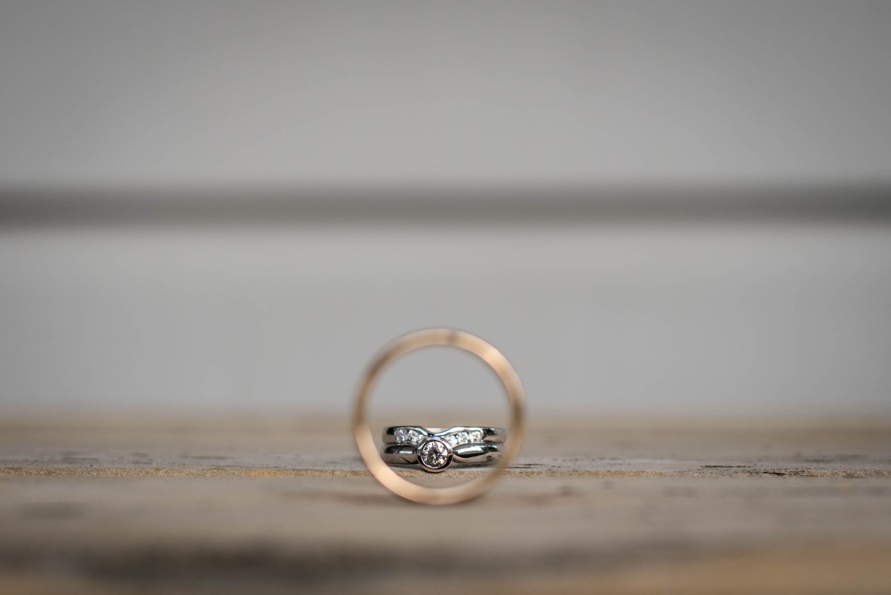 Engagement ring inside the circle of a wedding band.