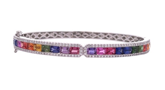 a white gold bracelet set with a rainbow of colorful gems