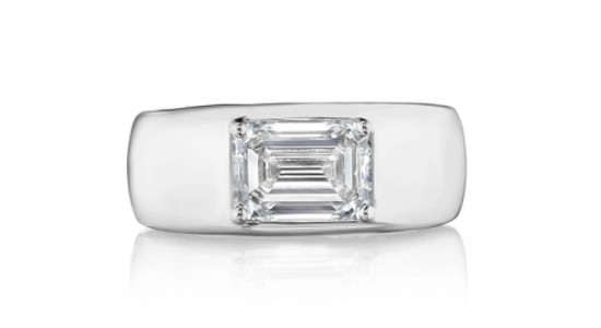 a white gold fashion ring with an emerald cut diamond