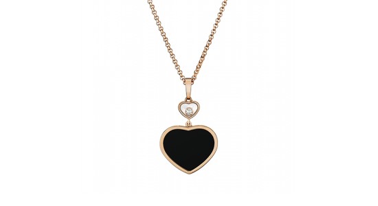 a rose gold necklace featuring a heart motif with a black heart and a diamond accent