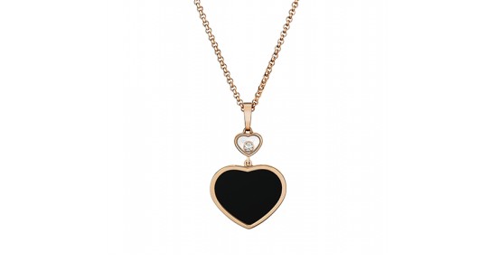 a rose gold necklace featuring a heart motif with a black heart and a diamond accent