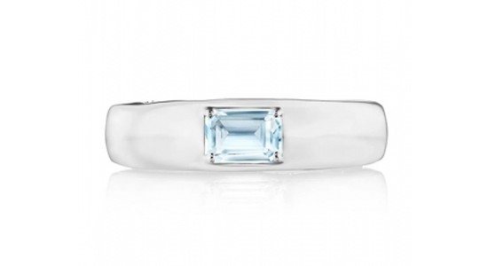 a white gold fashion ring featuring an emerald cut blue topaz gem