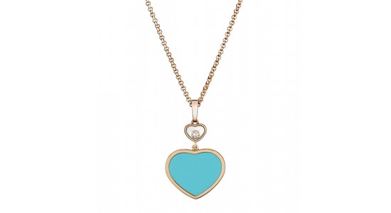 a yellow gold pendant necklace featuring a blue heart pendant