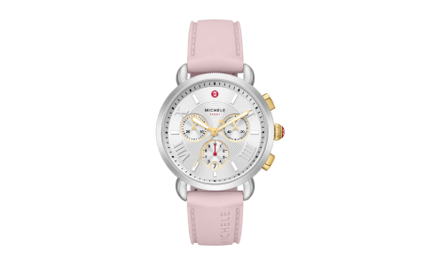 A stylish Michele sports watch with a pink leather band, available at Weston Jewelers.