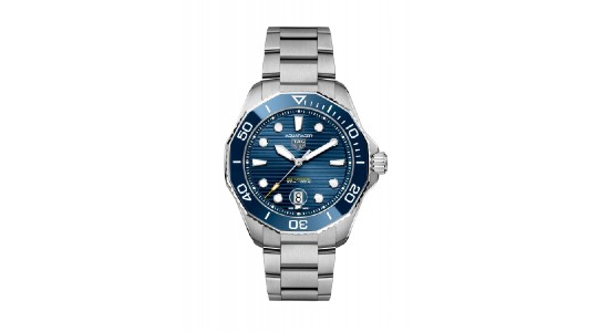 a white gold watch by TAG Heuer with a deep blue watch face