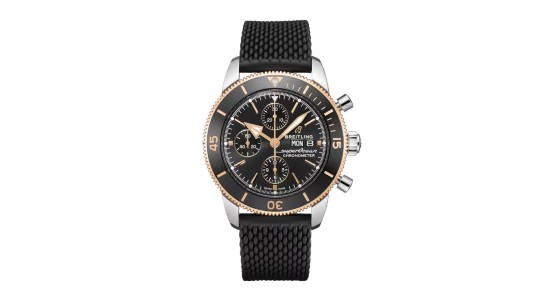 a black, silver, and rose gold dive watch by Breitling