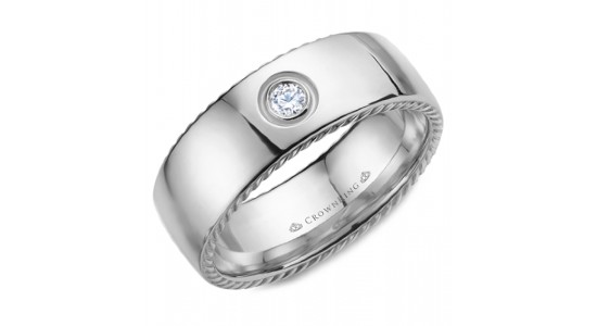 a platinum men’s wedding with a single diamond inlaid into it