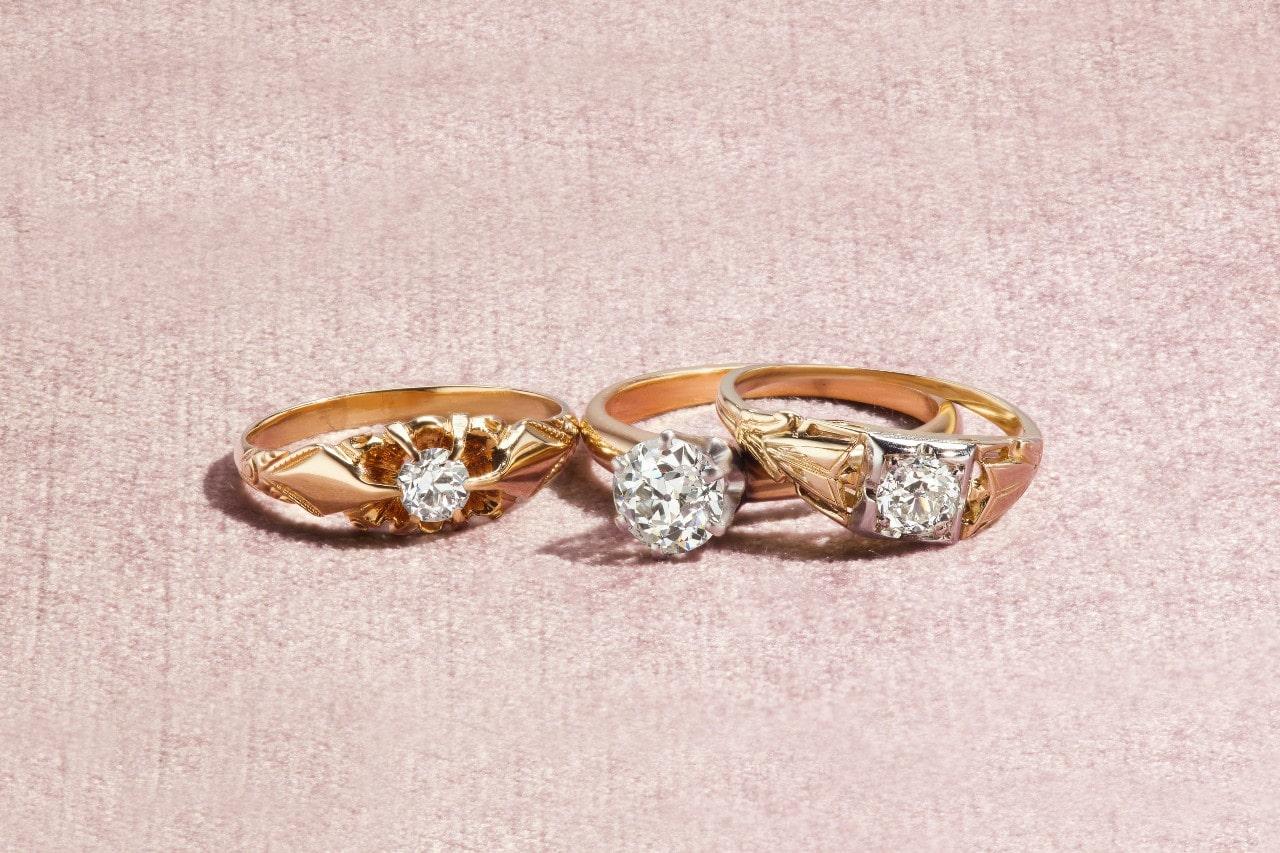 three uniquely designed yellow gold and diamond engagement rings three uniquely designed yellow gold and diamond engagement rings