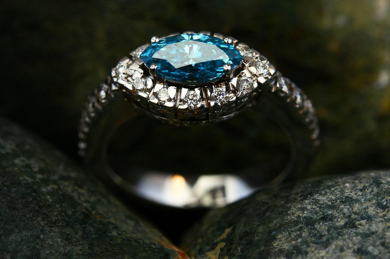 an engagement with with a horizontally oriented blue marquise cut center stone an engagement with with a horizontally oriented blue marquise cut center stone